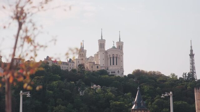 Basilica of Notre-Dame de Fourviere at sunset in Lyon, Rhone, France, wide shot