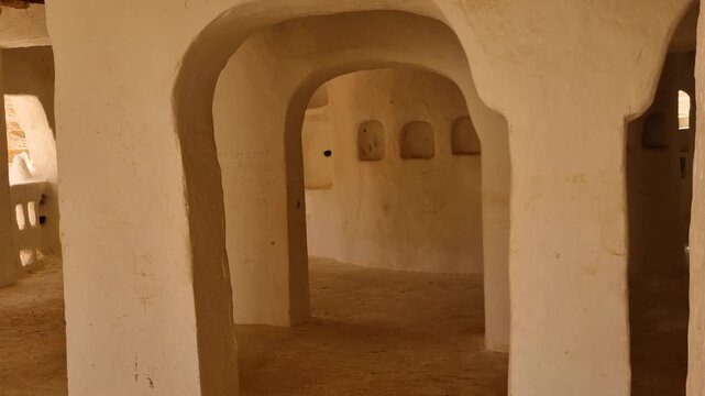 Interior of the Sidi Brahim Mosque in El Atteuf, Gharda&iuml;a, Algeria, featuring distinctive mudbrick arches crafted to withstand the extreme Saharan desert climate