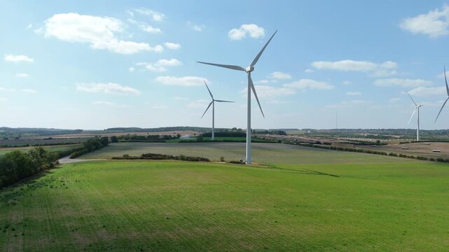 Aerial drone view of wind turbine windmill renewable energy generation electricity rural green farm landscapes Mansfield England UK summer sunny
