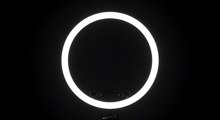 Luminous Portal: A Perfectly Centered Ring Light Glowing in Pitch Black Darkness