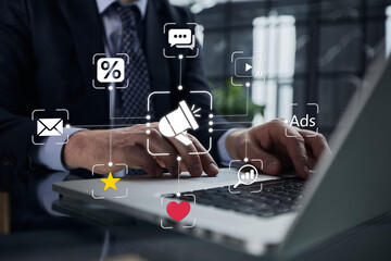 Digital marketing strategy. Announce promotions and campaigns via email and social media. Man using...