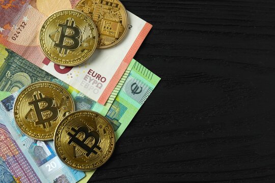 Shiny bitcoin crypto currency coins on euro banknotes