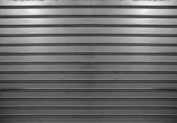 Obraz premium announcement advertisement ad on white empty blank of paper. White grey gray Corrugated metal garage gate background and texture surface or galvanized steel. mock up template, mockup mock-up