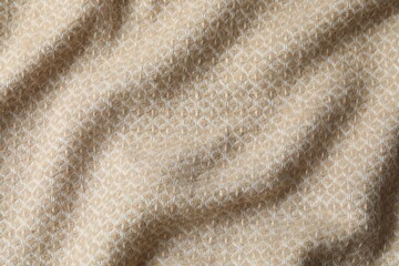 Beige warm blanket with waves, top view