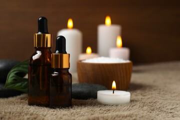 Spa and relaxation concept. Aromatherapy oil with candles in massage room
