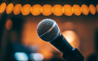 Microphone on Stage with Warm Bokeh Lights performance