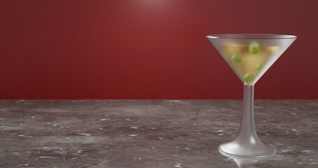 Drink or yellow cocktail bokeh shot with olives floating on top placed on a dark marble desk with red background