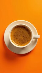 Fototapeta premium Aromatic coffee, white cup, bright orange backdrop Top-down view , espresso, colour