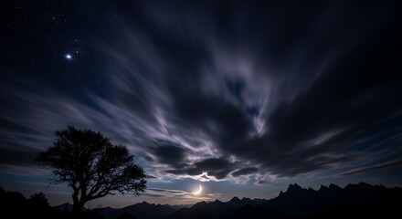 Crescent Moon Eclipse Over Mountain Silhouette at Night
