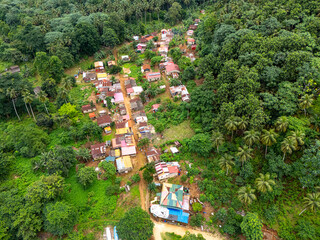 Aerial view of a small village on Rolas Island, São Tomé and Príncipe, surrounded by dense...