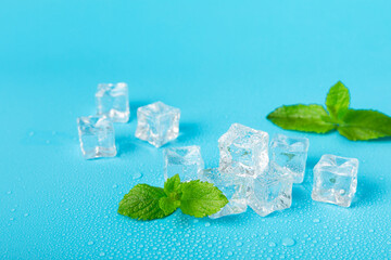 Mint and ice on texture background. Green fresh mint and ice cube. Mint leaves, ice cube and water...