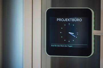 Digital control panel in modern office meeting room