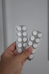 hand holding pills