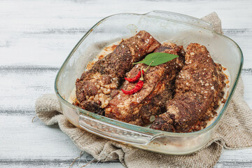 Baked pork ribs with spices, cold fat. Traditional ingredient for BBQ, picnic concept
