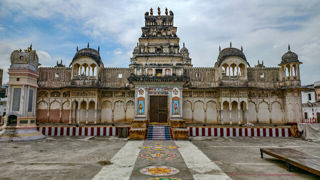 Rangji Temple facade in Pushkar, Rajasthan, India, captured in August 2025. Historic 19th-century South Indian style architecture under a partly cloudy sky