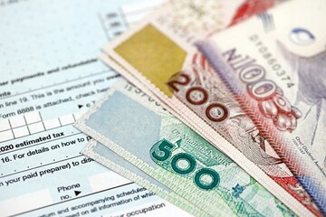 Nigerian naira money bills on tax form. Taxation and accounting concept