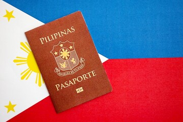 Philippines passport on flag. The concept of citizenship