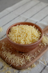 Organic Grated Cheese Mix in a Bowl, side view.