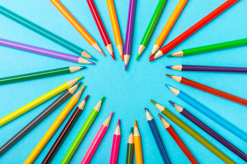 Colored pencils on a bright colored background. Equipment for coloring. Stationery for creativity.Back to school. Flatlay. Children's Creativity and Education. Rainbow.Space for text. Copy space.