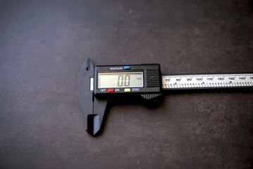 Photo of digital caliper on dark background