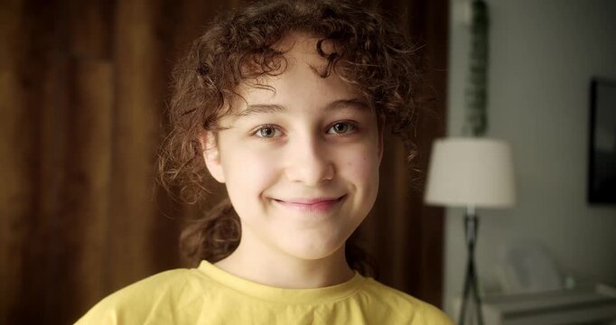 Portrait happy teen girl smiling child looking at camera at home, cute kid child with pretty face. Concept of a happy childhood. 4K