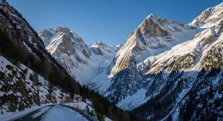 A Sunlit Winter Drive Through a Majestic, Shadow-Carved Alpine Valley