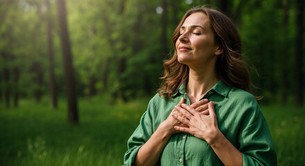 Fototapeta premium Emotional Woman in Green Shirt Outdoors, Nature Embrace, Serene Forest Setting, Lifestyle Photography