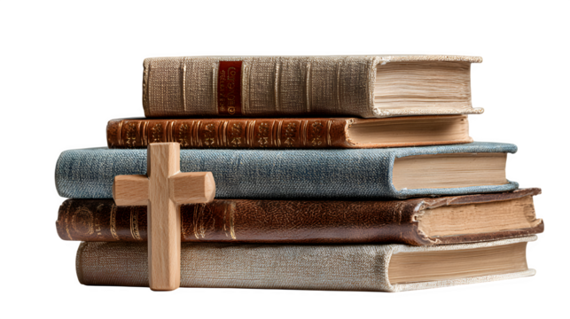 Stack of religious books with wooden cross on top isolated on white