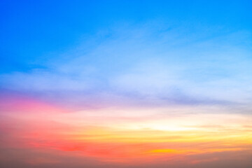 Obraz premium Beautiful , luxury soft gradient orange gold clouds and sunlight on the blue sky perfect for the background, take in evening,Twilight, Large size, high definition landscape photo