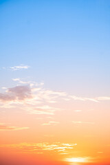 Beautiful , luxury soft gradient orange gold clouds and sunlight on the blue sky perfect for the background, take in evening,Twilight, Large size, high definition landscape photo,Vertical