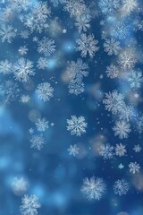 Falling snowflakes against a blue bokeh background