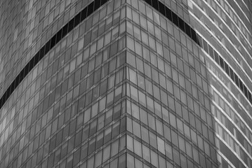 walls and empty windows of a modern building on a big city street without people