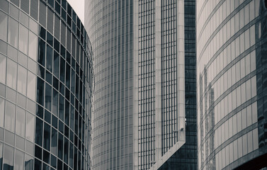 walls and empty windows of a modern building on a big city street without people