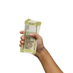 Hand holding multiple Indian 20 rupee notes