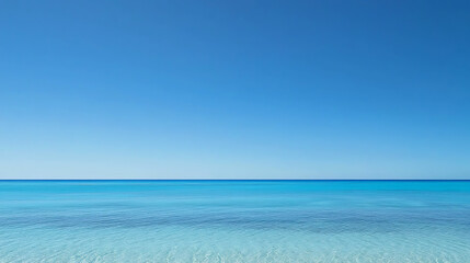 Obraz premium The ocean is calm and clear, with a bright blue sky above