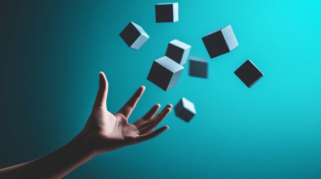 Hand throwing floating cubes in midair over blue background for creativity and abstract motion concept design