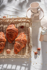 Crunchy and tasty french nut croissants served with coffee.