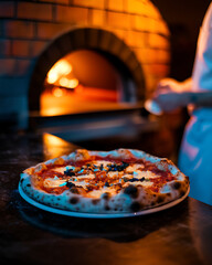 Delicious margherita pizza freshly baked in a traditional brick wood fired oven