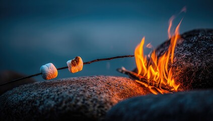 Marshmallows roasting over a campfire on rocks by the water