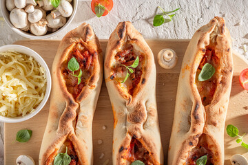 Homemade fruste Margherita made of tomatoes, basil and cheese.