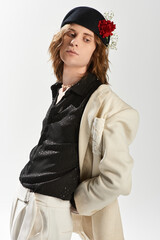 Handsome young man in trendy fashion exudes feminine charm in stylish attire