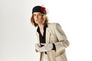 Stylish young man expresses feminine elegance in contemporary fashion setting