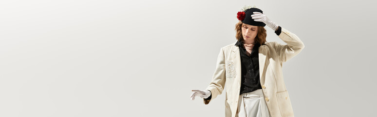 Fashion forward expression of a handsome young man showcasing unique style and elegance