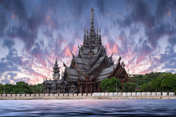 Sanctuary of Truth temple construction on sunset in Pattaya, Thailand. The sanctuary is an all-wood...