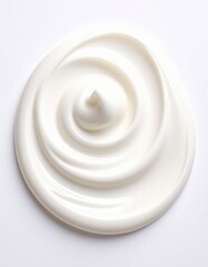 A smooth, creamy swirl of white substance resembling lotion or a cosmetic product on a light background.