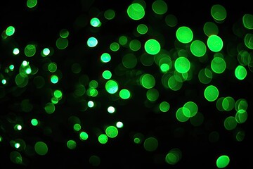 Abstract bokeh of vibrant green circles on a black background