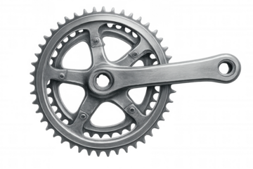 Metallic bicycle crankset rotating, generating power and transmitting force to the drivetrain, isolated on transparent background