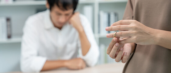 Divorce. Woman remove married ring. Couples desperate and disappointed after marriage. Husband wife...