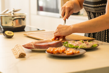 Close-Up of Homemade Sushi Preparation with Fresh sashimi and avocado on a Kitchen Counter