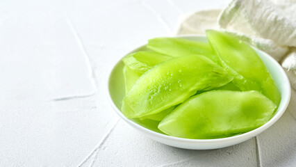 closeup green slice cut wosun or celtuce stem lettuce food white background with copy space